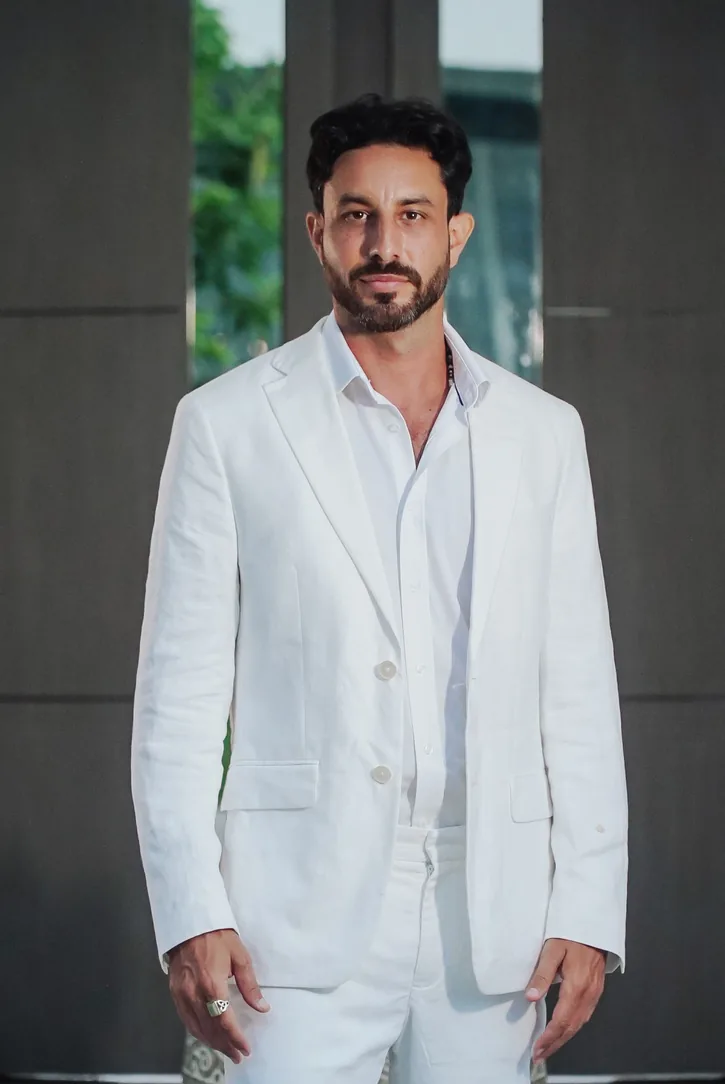 Lukaijah in a white linen suit